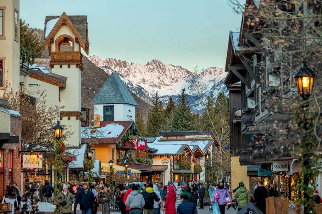 People exploring a Vail Christmas market.